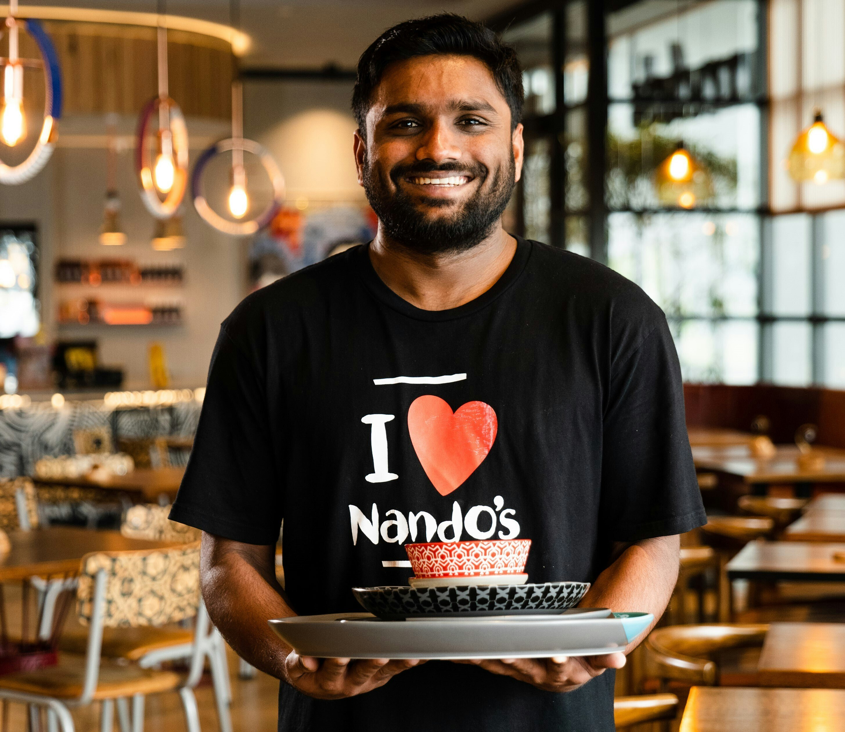 Picture of Nando's staff member smiling